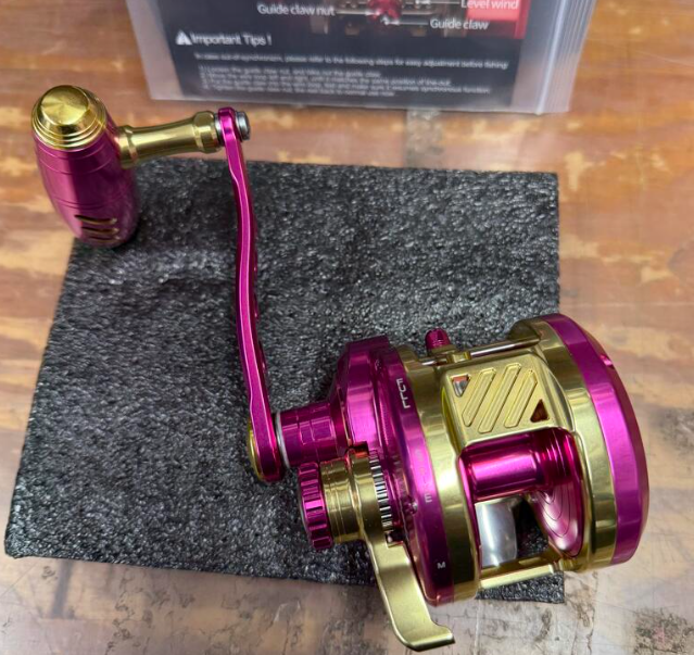 Maxel Armory 35L Level Wind Pink And Light Gold Conventional Reel Left Hand