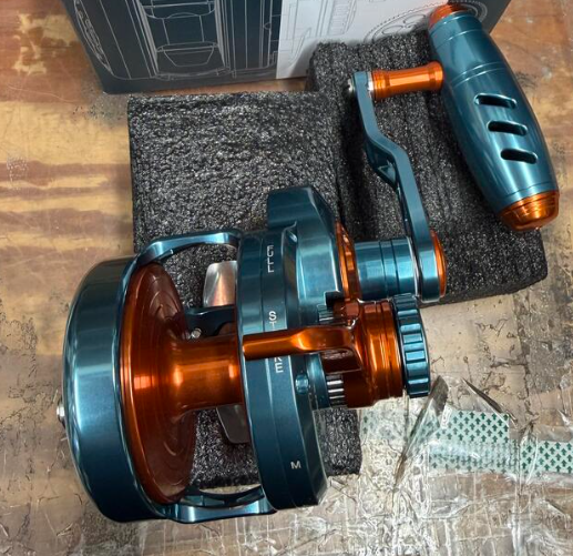 Maxel Rage Pro 60 Dark Grey Blue Orange Conventional Reel Right Hand