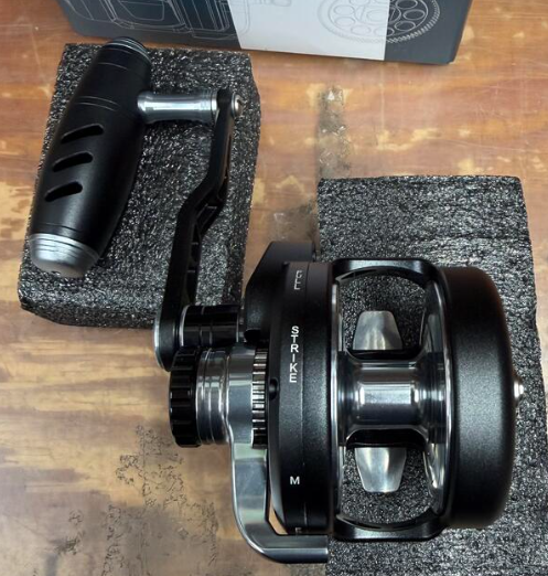 Maxel Rage Pro 60L Matte Black Light Gray Conventional Reel Left Hand